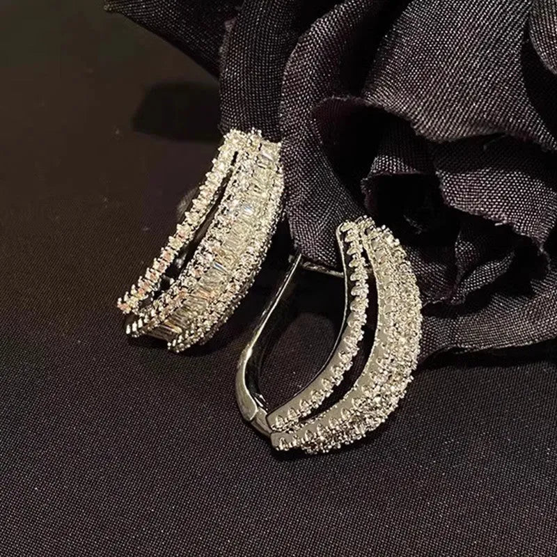 White gold colour geometry stud earrings with inlaid zircon details on copper bases