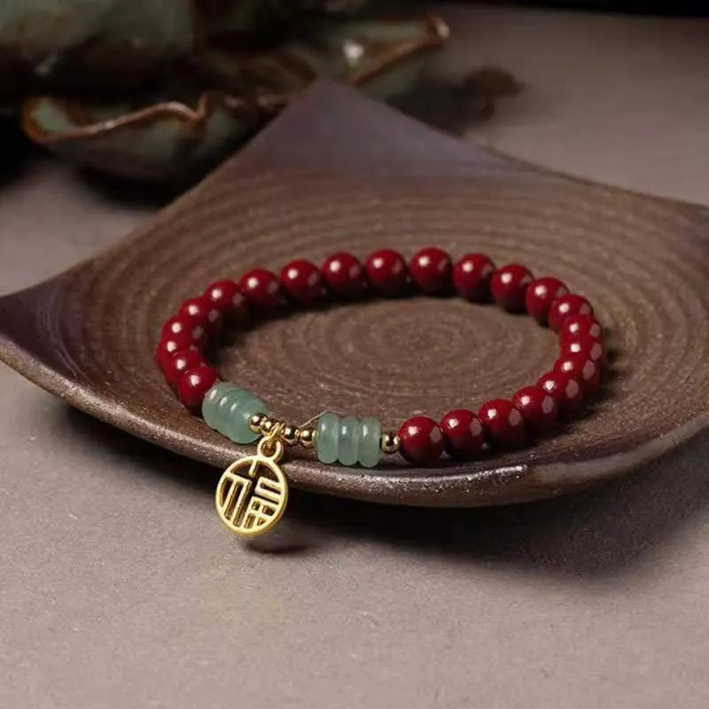 Handmade gold cinnabar wave bracelet with copper beads in national style unisex design.