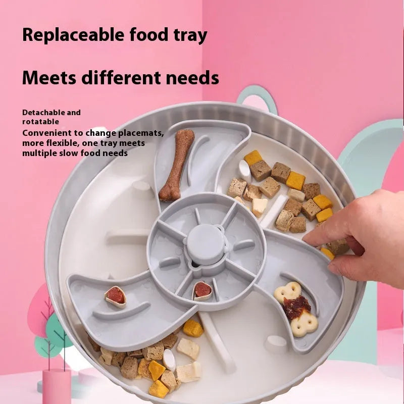 Grey plastic pet bowl with rotating windmill-pattern slow feeder licking mat inside