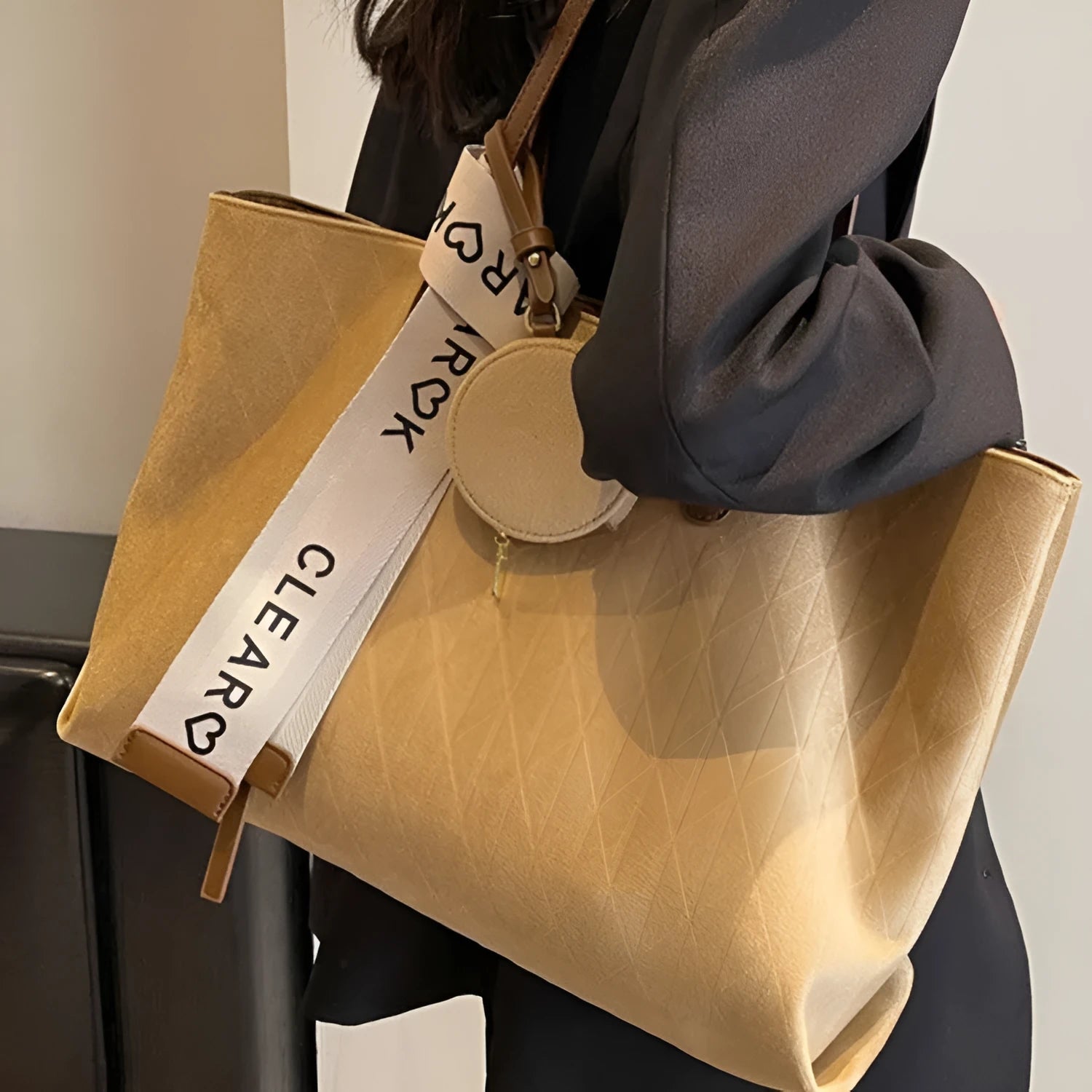 Soft polyester large tote shoulder bag in a horizontal square shape with an external pocket.