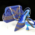Women's pink pointed toe high heel shoes with rhinestones and a matching small clutch bag.
