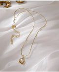 Baroque freshwater pearl necklace with titanium steel golden chain on display