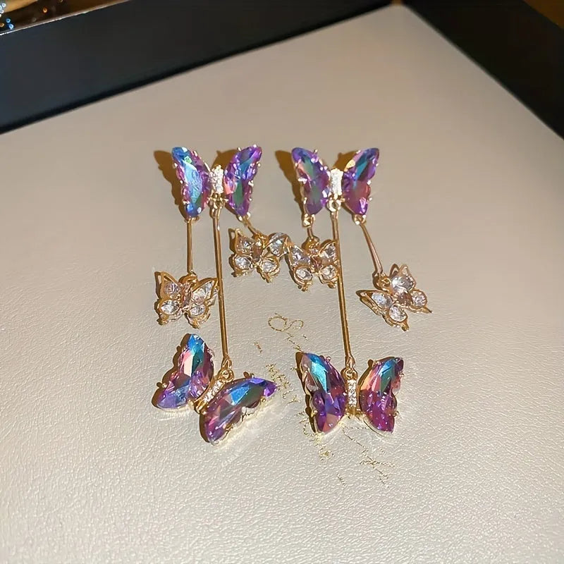 Silver needle colour crystal butterfly earrings with blue-purple electroplated finish and tassel elements