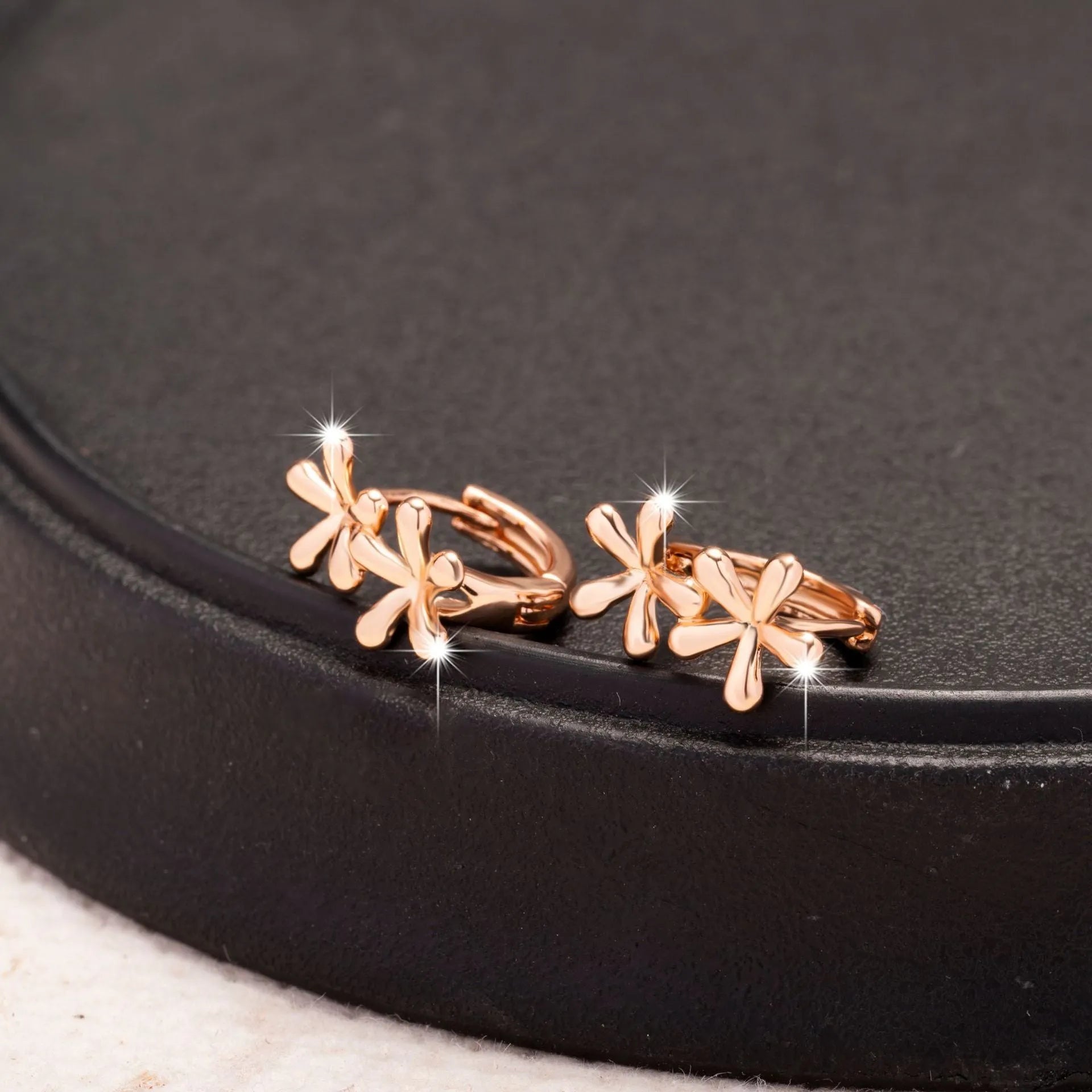 Electroplated rose gold waterdrop flower earrings with circular design for women