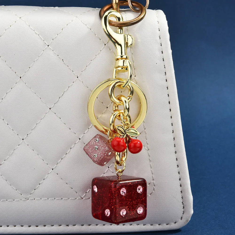 Square metal dice keychain pendant with cherry electroplated finish and keychain attachment