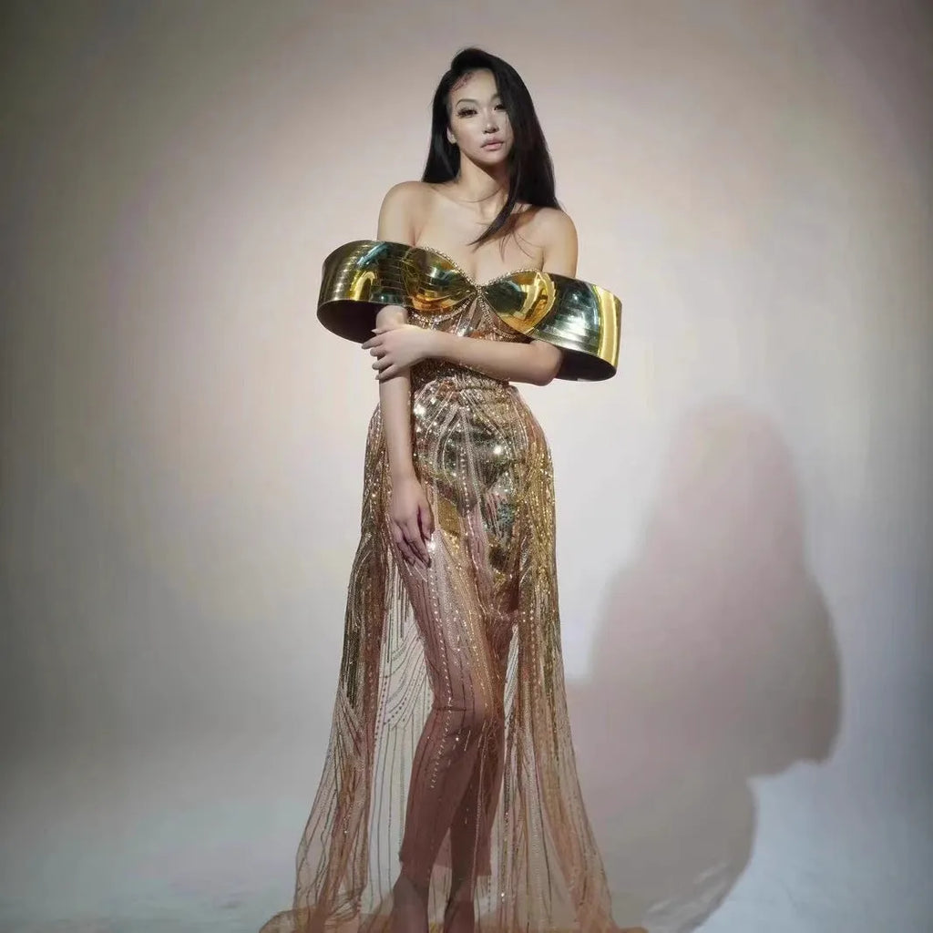 Gold sequined strapless dress with tulle skirt and thigh-high split, shown on mannequin