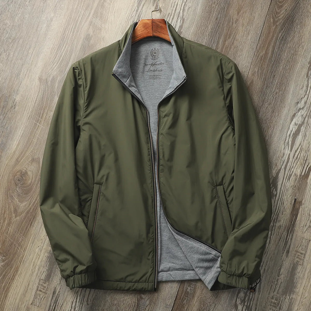 Men's simple stand collar jacket in polyester and cotton blend shown in one of four available colours.