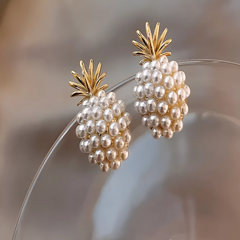 Korean-style women's drop earrings with a pineapple starfish pearl design in alloy with stone inlay.