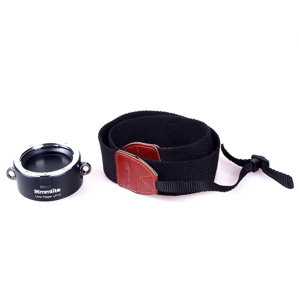 Aluminium camera lens flipper holder for Nikon with cotton shoulder strap.