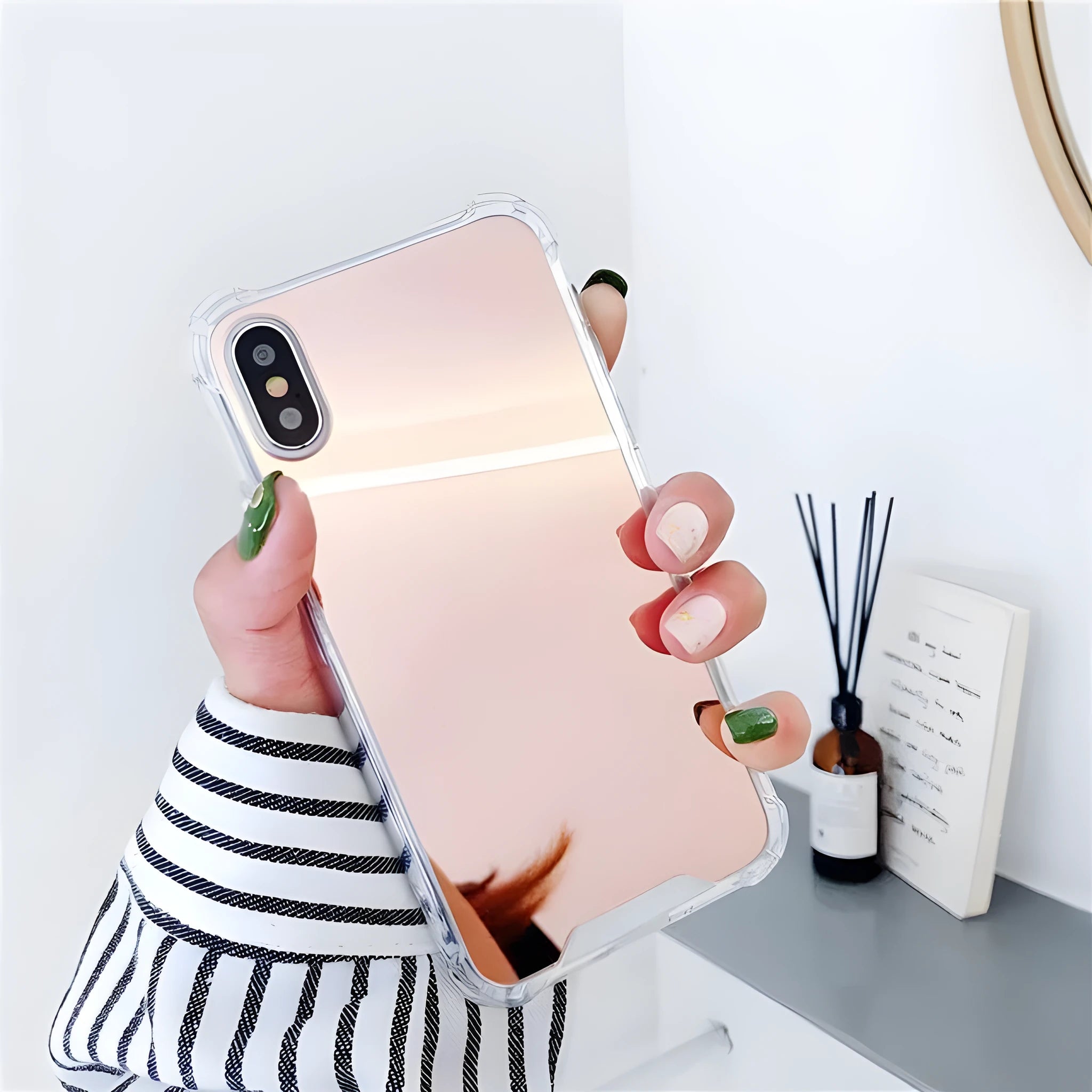 Mirrored back protective TPU case for iPhone on a table