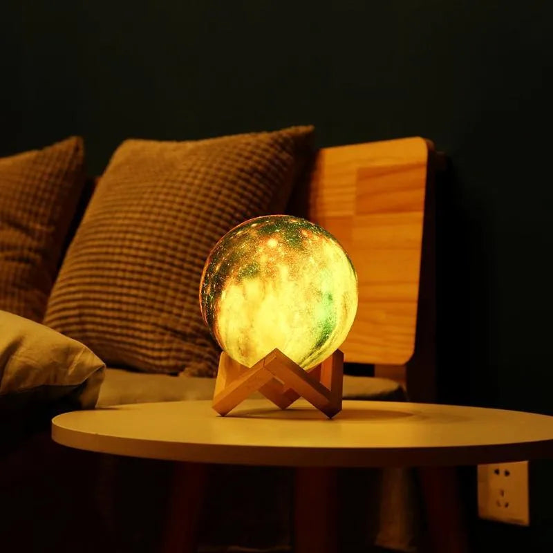 3D-printed spherical lunar night light with remote control on wooden table