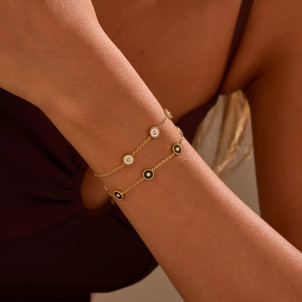 Geometric fritillary design stainless steel bracelet with 18K gold plating and matching necklace