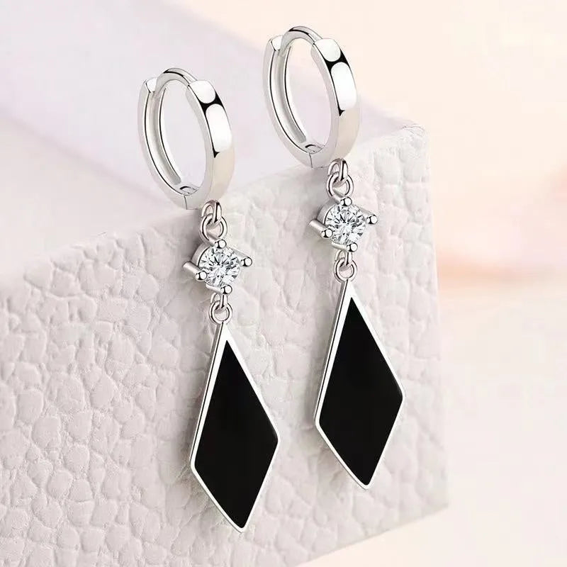 Silver vintage geometric diamond-shaped clip earrings for women.