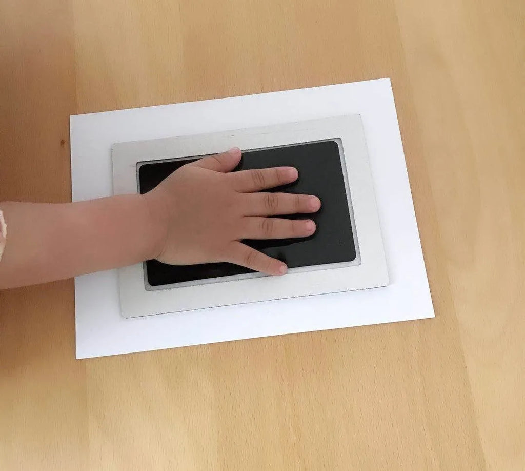 Baby hand and foot printing kit with anti-cross infection disposable pad and photo frame