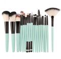 MAANGE 18-piece makeup brush set with fan-shaped cosmetic tools laid out on a table.