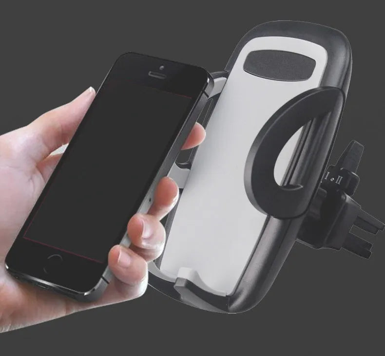 Black plastic car mobile phone holder mounted on vehicle air conditioning outlet