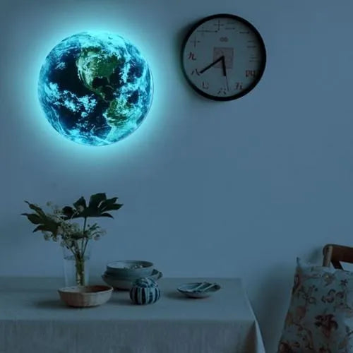 Glow in the dark 3D Earth planet wall sticker in three size options on a dark background