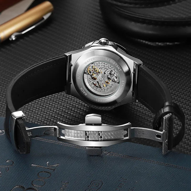 Men's automatic mechanical watch with skeleton dial and diamond bezel on wrist