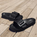 Women's grey blue buckle fastening flip-flop sandals with soft EVA sole on a white background.