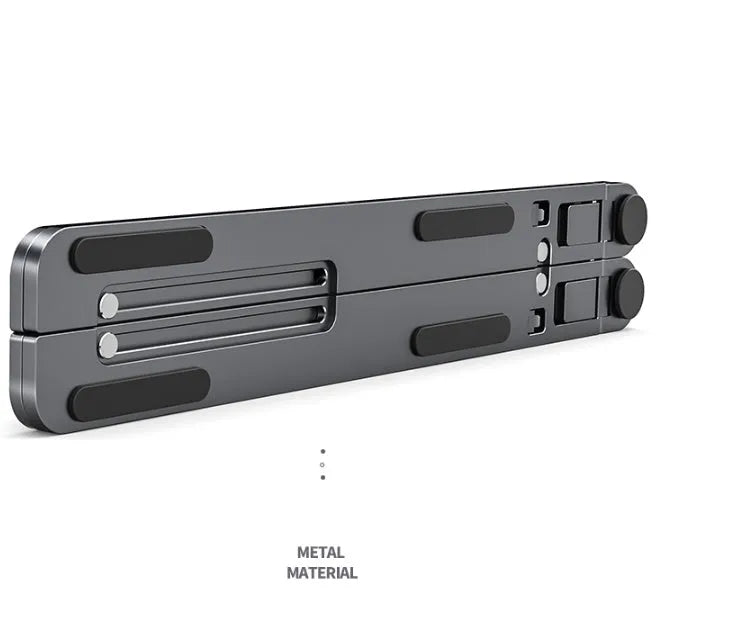 Deep grey portable aluminium laptop stand, folded flat next to an open laptop showing its adjustable height.