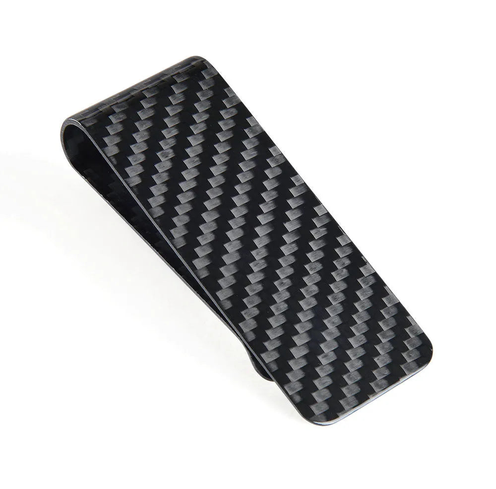 Black genuine carbon fiber money clip with striped glossy surface on a plain background