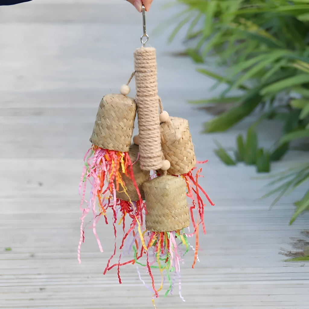 Wood and sisal parrot toy with colourful shredded paper filling, size 15 by 35 centimetres