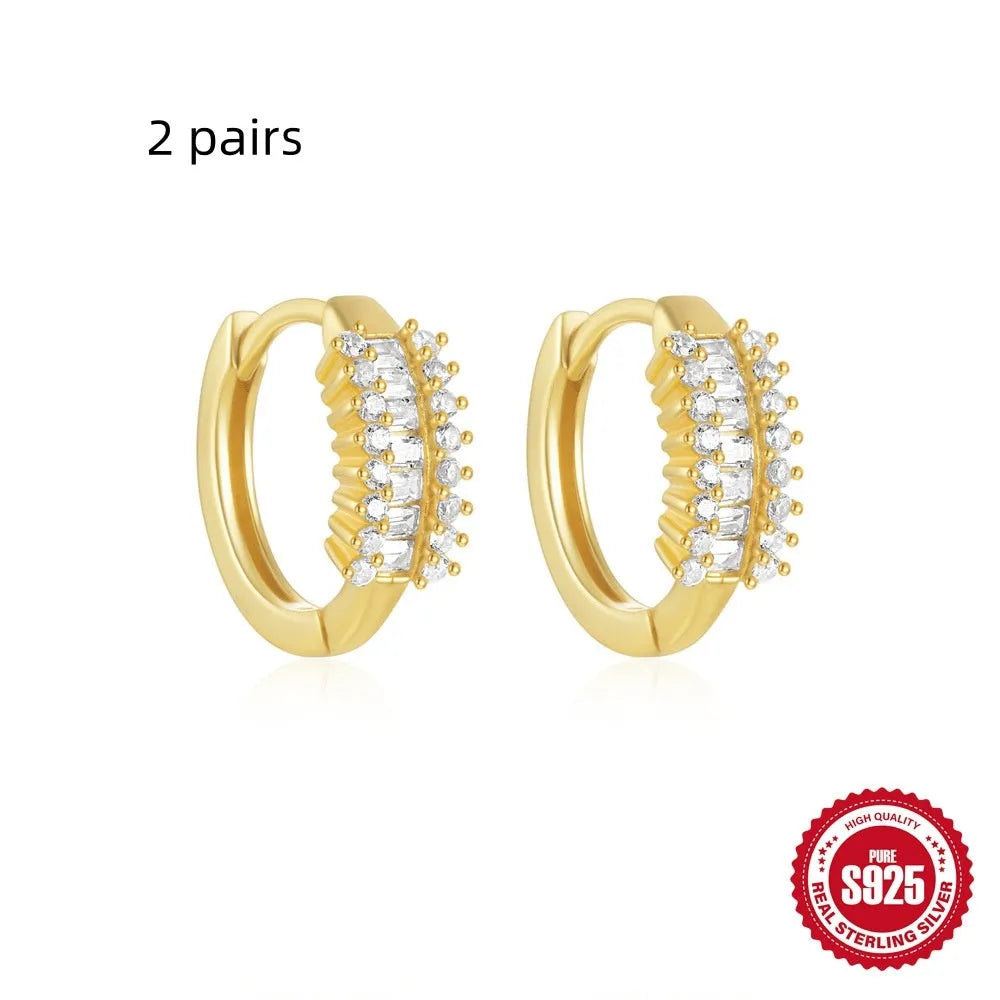 Sterling silver geometric stud earrings with small round diamond accents in gold or silver electroplated finish