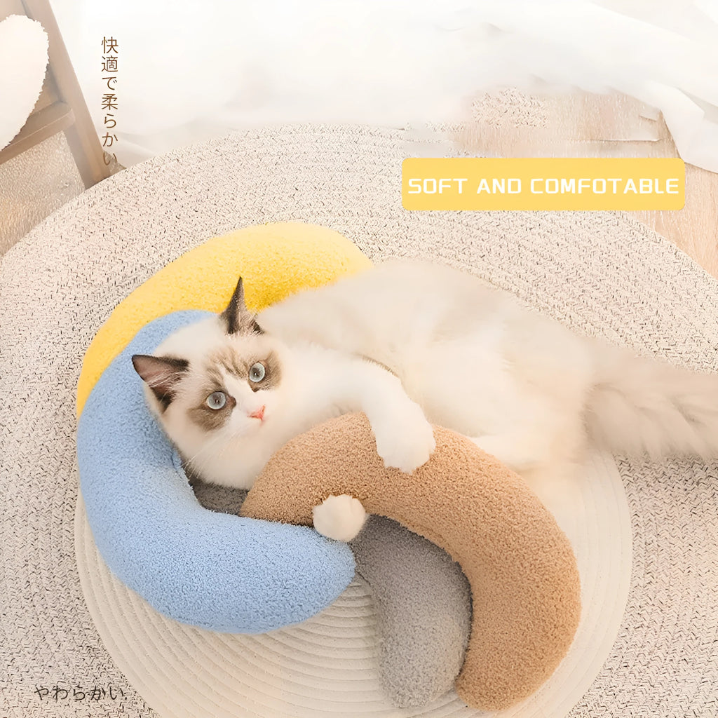 U-shaped blue cat pillow with an adjustable fabric collar for pet neck support.