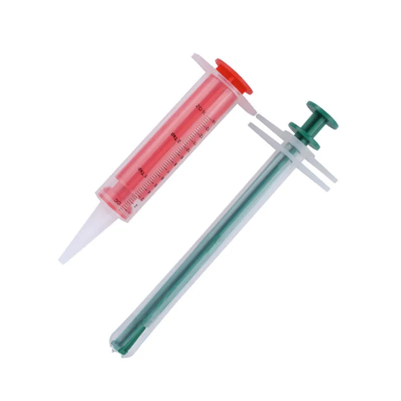 Two pet pill shooters with soft silicone tips for administering medication to cats and dogs