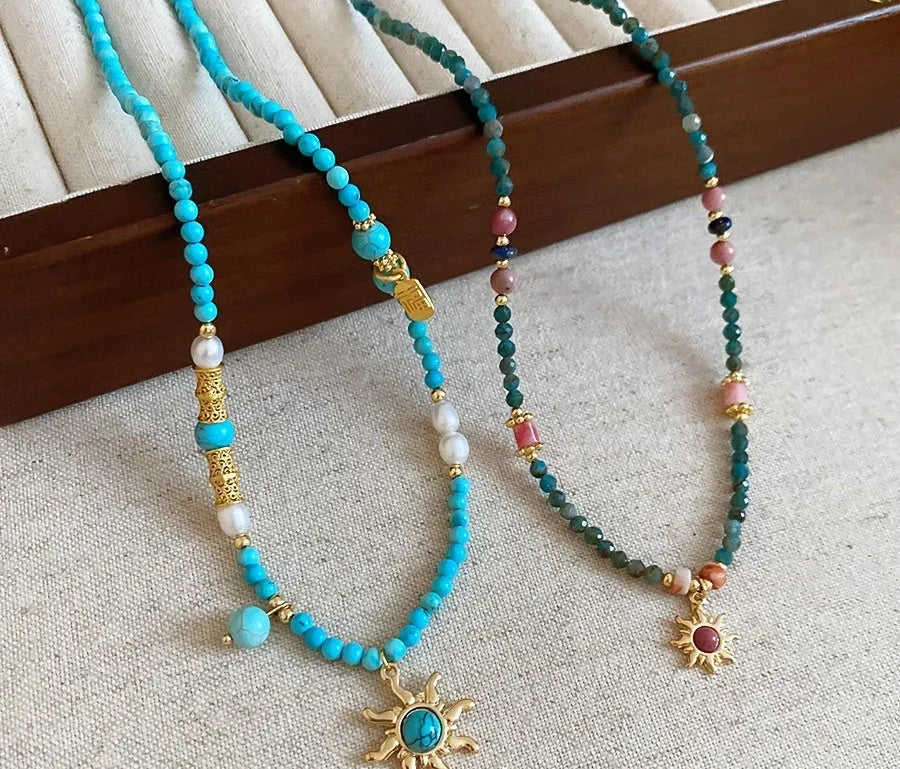 Freshwater pearl necklace with geometric stone sun pendant on clavicle chain