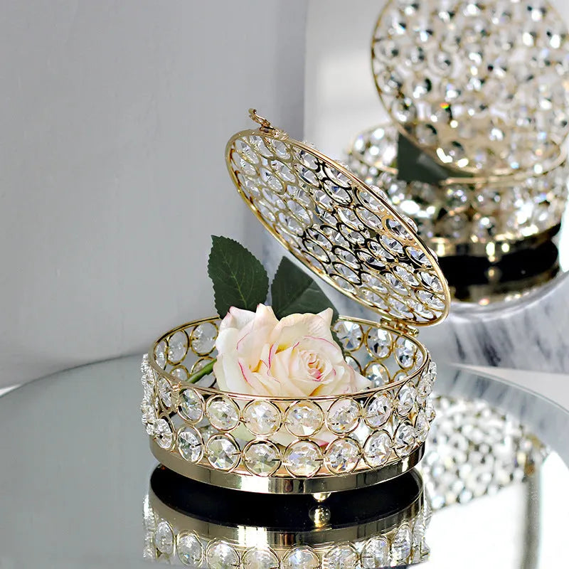 Crystal glass jewellery box with transparent sides and a French gold metal frame.