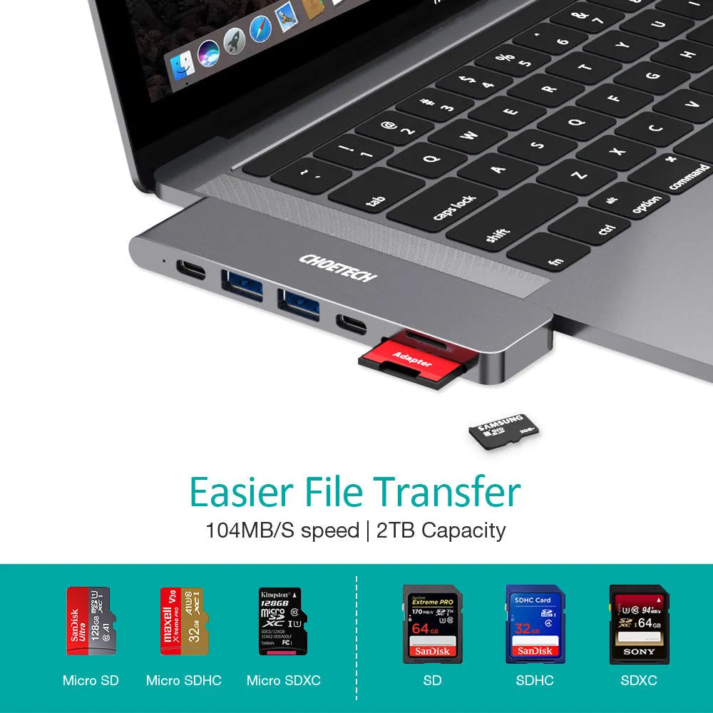 Compact aluminium USB-C hub adapter with SD card slot, microSD slot, two USB ports, HDMI, and charging port.
