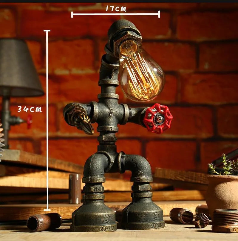 Robot vintage industrial table lamp with iron pipe construction in green bronze finish