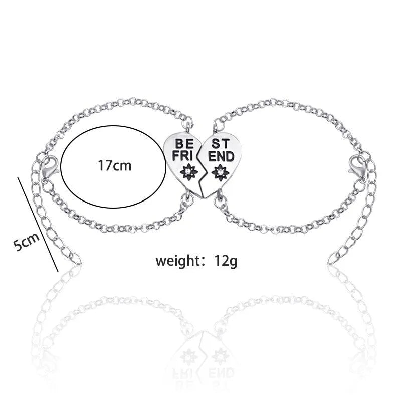Heart shape alloy bracelet with dripping oil finish and inlaid gems in gold and silver colours