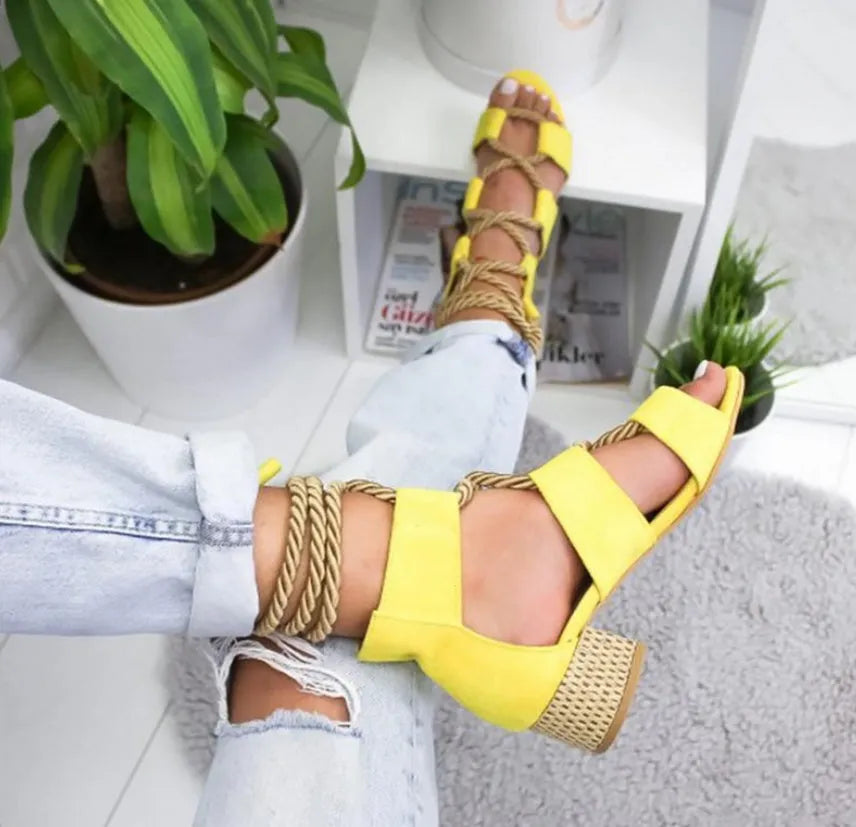 Women's beige suede sandals with a chunky heel, colour-block panels, and an ankle strap.
