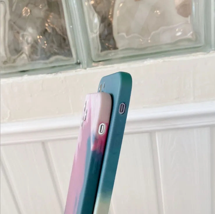 Soft silicone iPhone case with blue and purple geometric gradient abstract pattern.