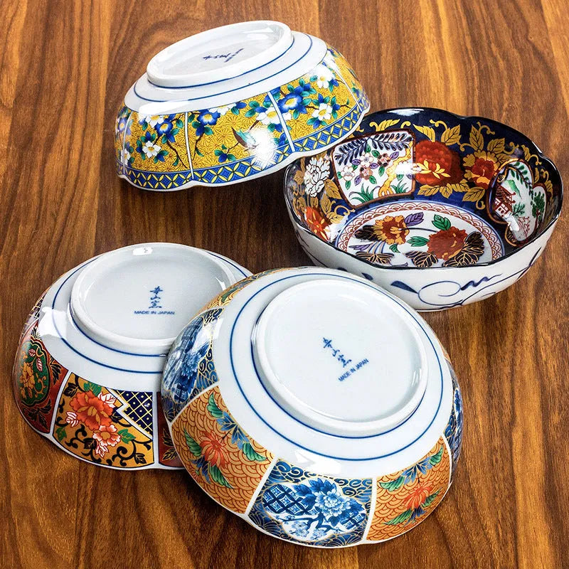Retro Japanese style porcelain bowls with peony patterns in gold and yellow colours