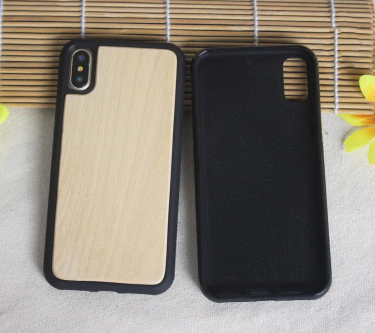 Wooden iPhone case with carbonised bamboo back and black TPU sides on a wooden table.