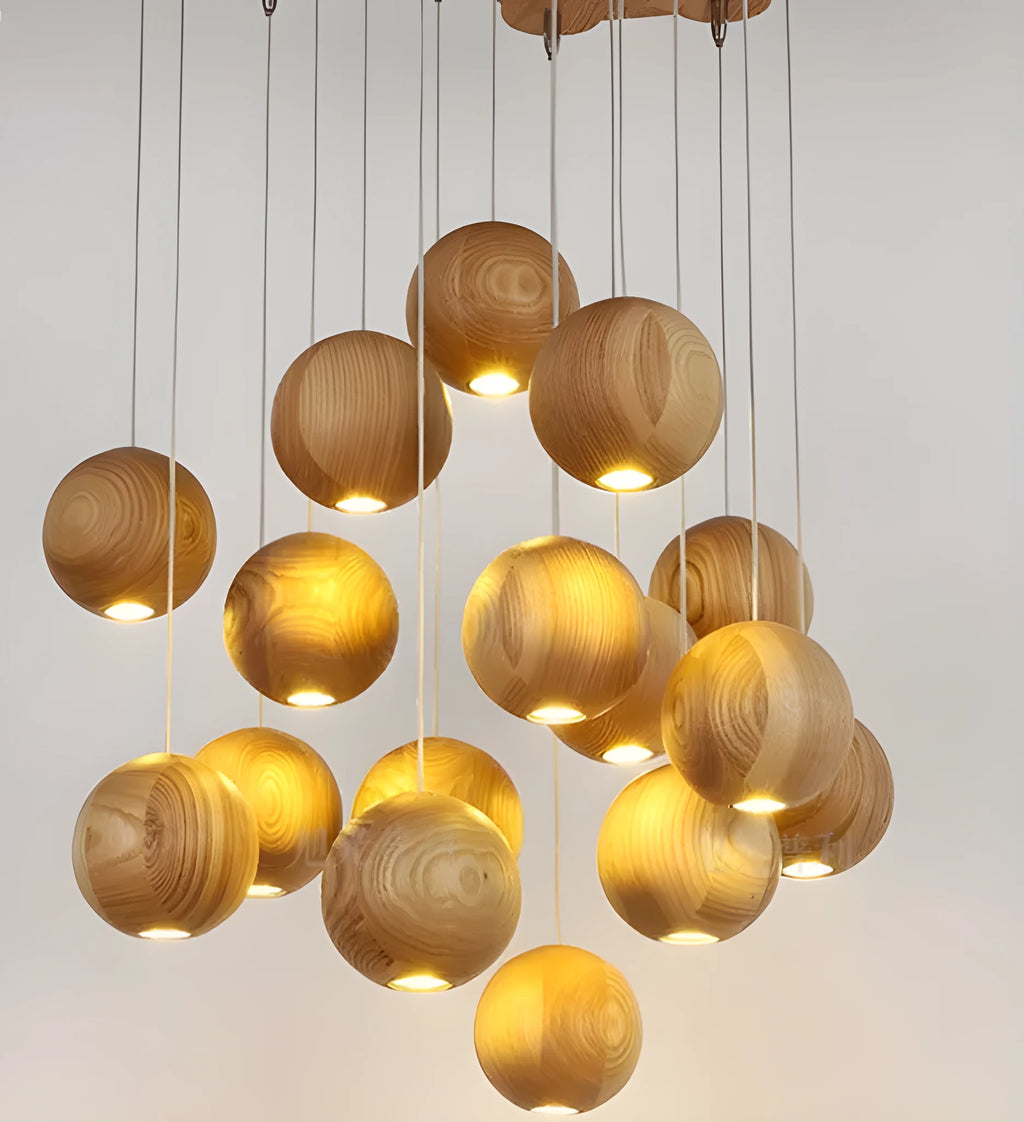 Nordic style solid wood ball chandelier with wooden spheres hanging from a wood disc ceiling plate.