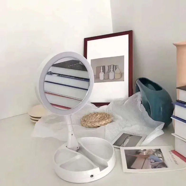 White foldable LED vanity mirror with double-sided magnification and USB charging port