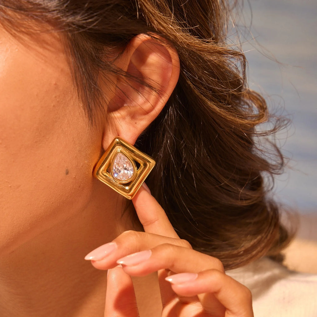 Geometric water drop shaped stud earrings with zircon inlay and gold electroplated finish