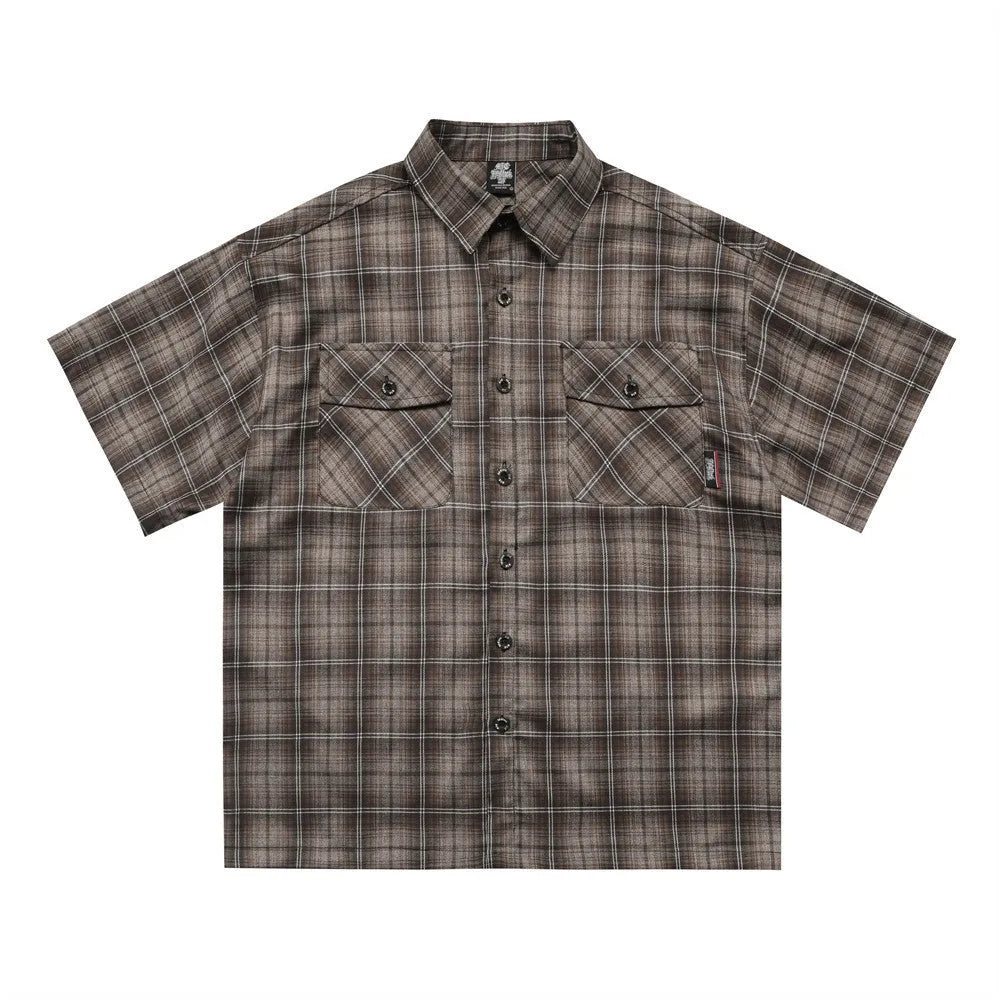 Men's black and brown plaid short sleeve shirt with embroidered letter detailing on the front