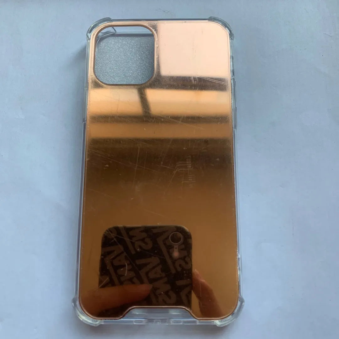 Mirrored back protective TPU case for iPhone on a table