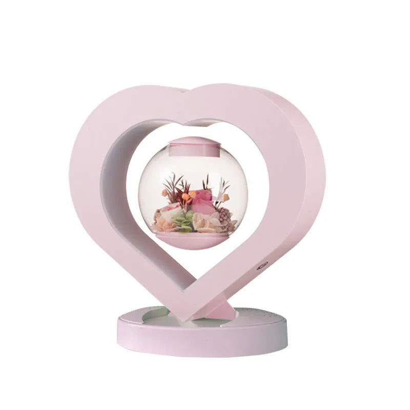Pink preserved rose decorative ornament with optional base and Bluetooth speaker functionality.