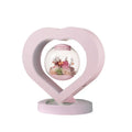 Pink preserved rose decorative ornament with optional base and Bluetooth speaker functionality.