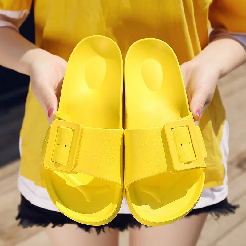 Women's grey blue buckle fastening flip-flop sandals with soft EVA sole on a white background.