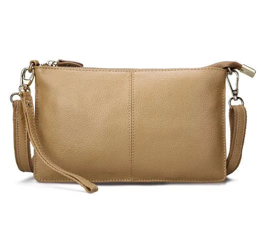 Structured cowhide leather lady slant bag showing front zipper compartment and dual strap options