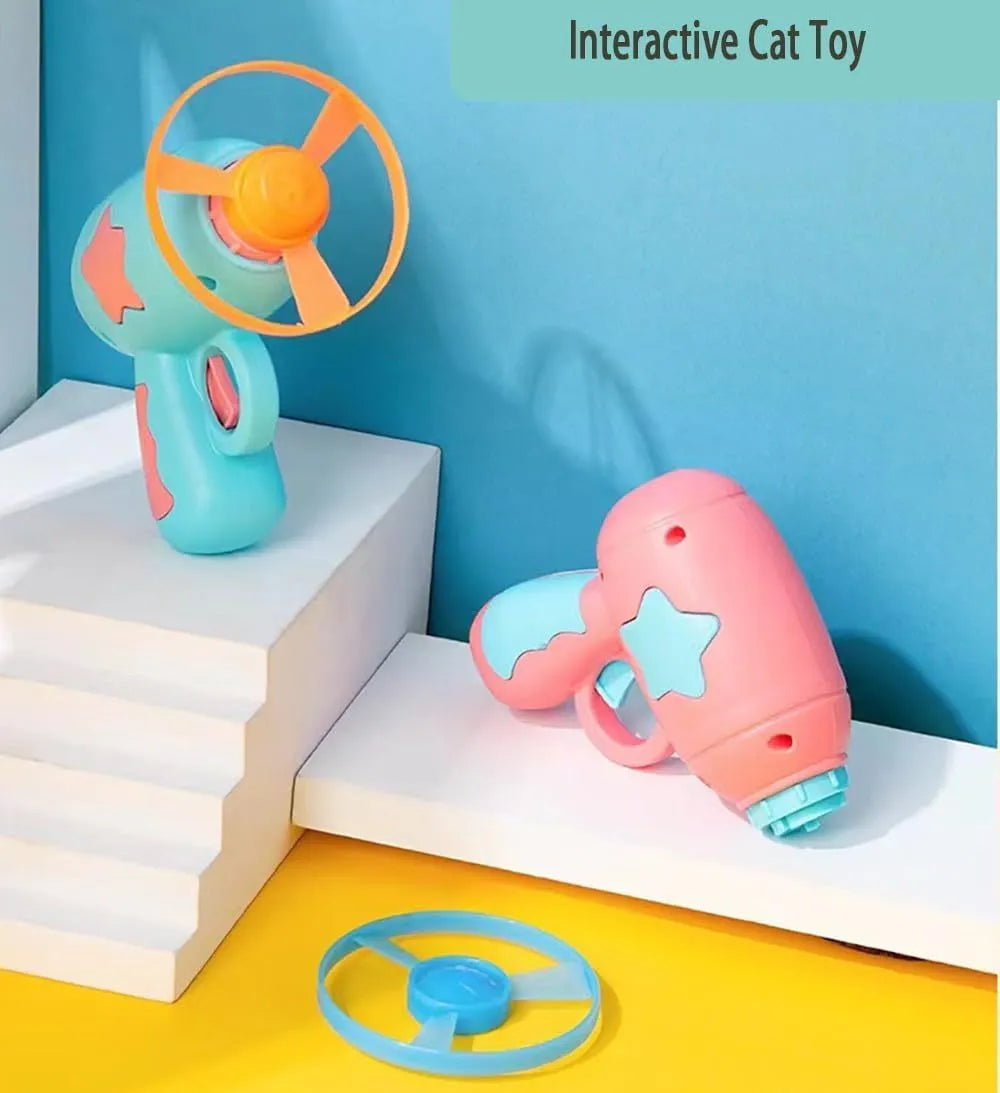 Blue plastic cat toy gun with spinning frisbee for indoor feline entertainment