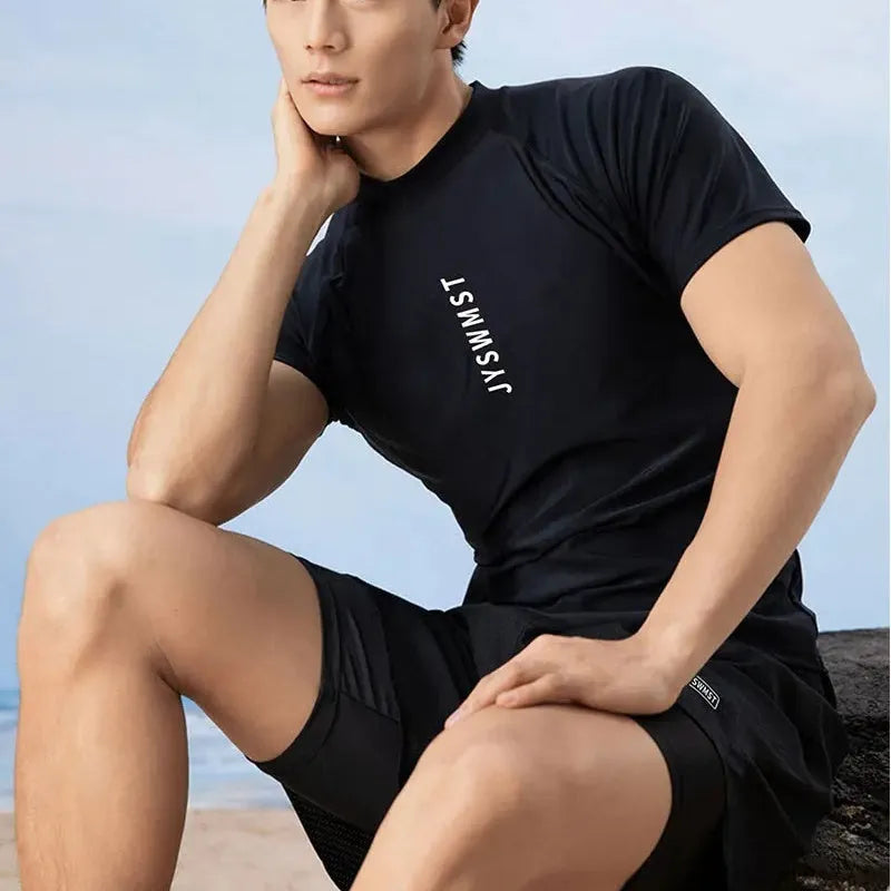 Men's two-piece polyester swim set showing short-sleeved swim top and matching trunks on a hanger.