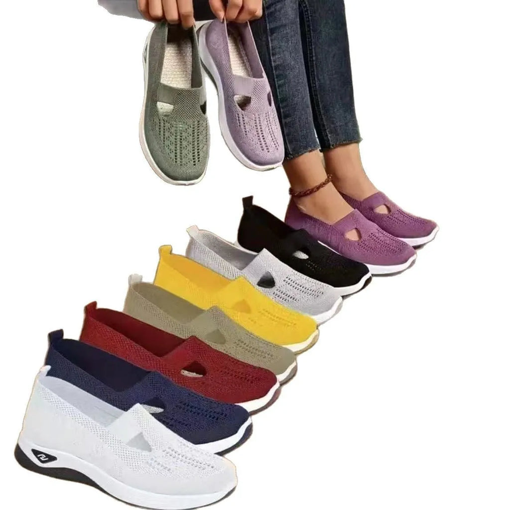 Elderly woman's black mesh T-strap shoe with soft PVC sole and round toe